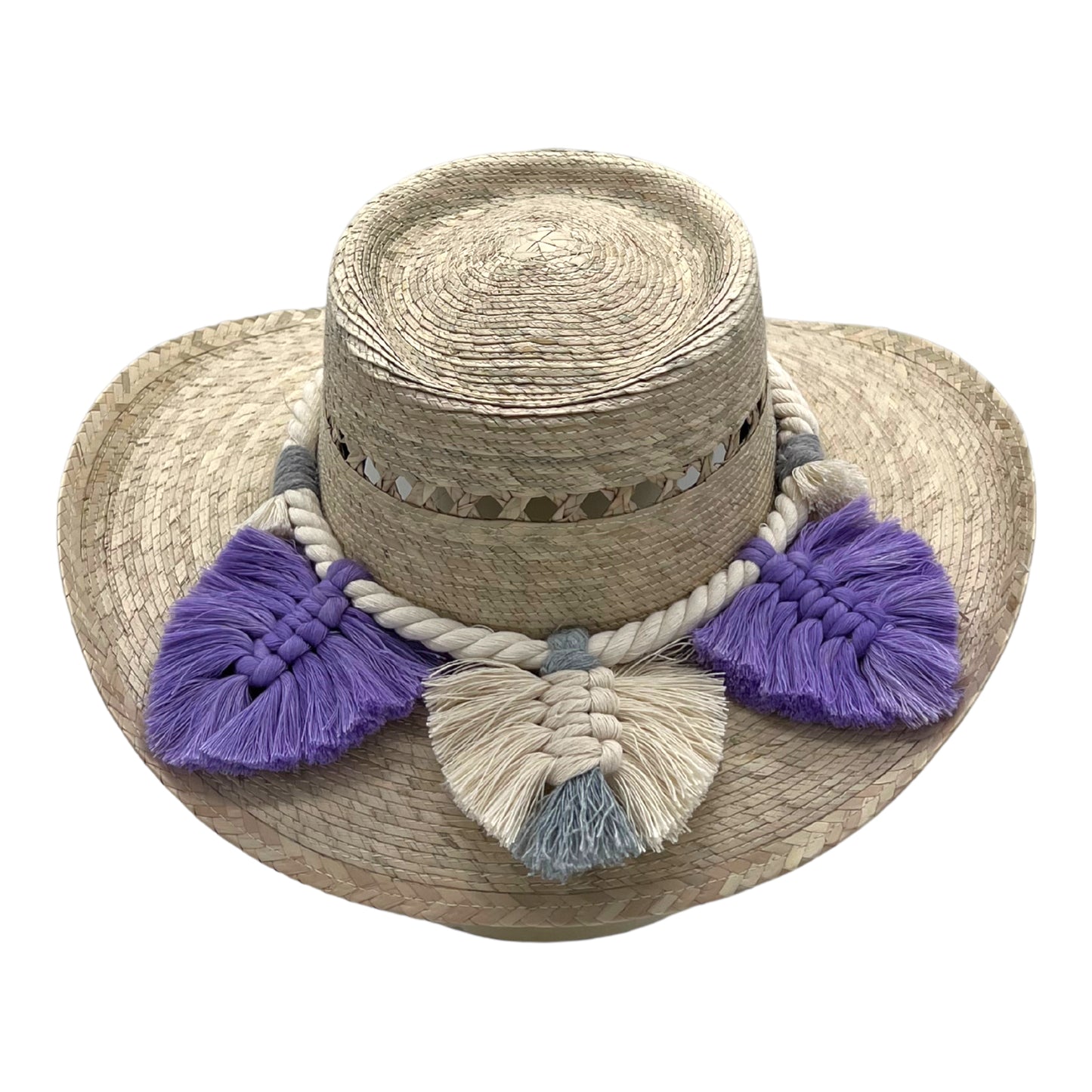 natural straw hat with a flat crown, decorated with a braided white band and lavender and cream tassels around the brim.